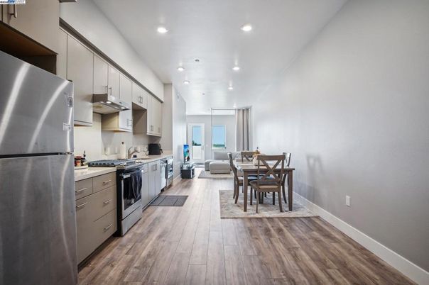 Dining room, Interior, Kitchen, Recessed Lighting, Stainless Steel Appliances, Wood Texture Flooring