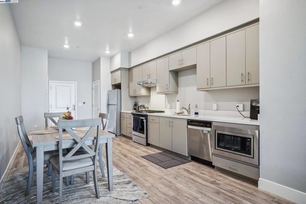 Dining room, Interior, Kitchen, Recessed Lighting, Stainless Steel Appliances, Wood Texture Flooring