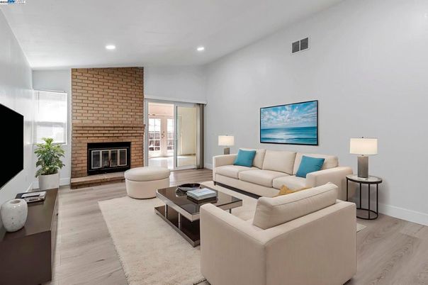 Fireplace, Interior, Living room, Recessed Lighting, Stone Walls, Wood Texture Flooring