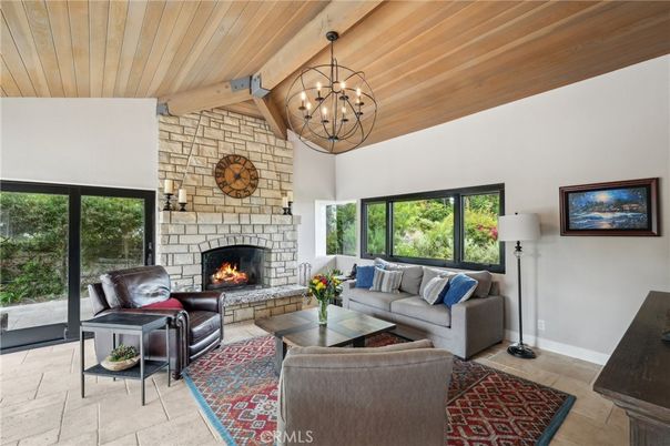 Chandelier, Fireplace, Interior, Living room, Pendant Lights, Stone Walls, Wooden Beams, Wooden Ceilings