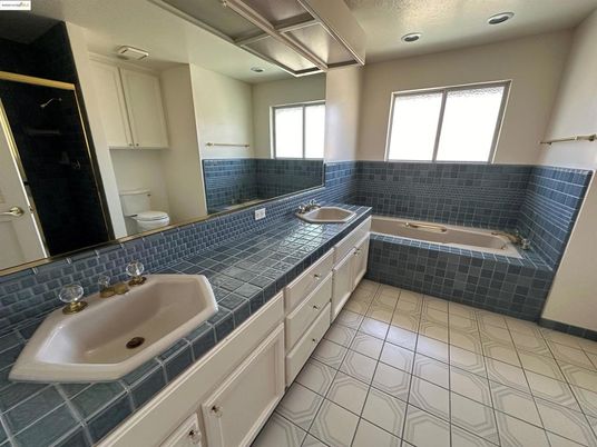 Bathroom, Dual Sink Vanities, Interior, Recessed Lighting, Tile Countertops
