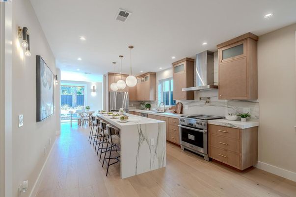 Dining room, Interior, Kitchen, Pendant Lights, Recessed Lighting, Stainless Steel Appliances, Wood Texture Flooring