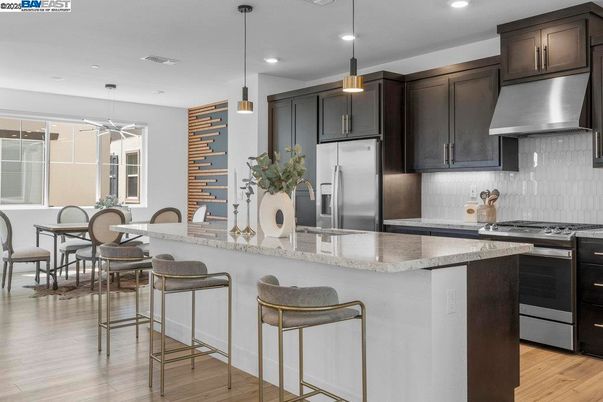 Dining room, Interior, Kitchen, Pendant Lights, Recessed Lighting, Stainless Steel Appliances, Wood Texture Flooring