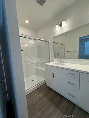 Bathroom, Dual Sink Vanities, Glass Shower, Interior, Recessed Lighting, Wood Texture Flooring