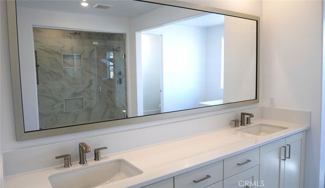 Bathroom, Dual Sink Vanities, Glass Shower, Interior, Marble Walls, Recessed Lighting