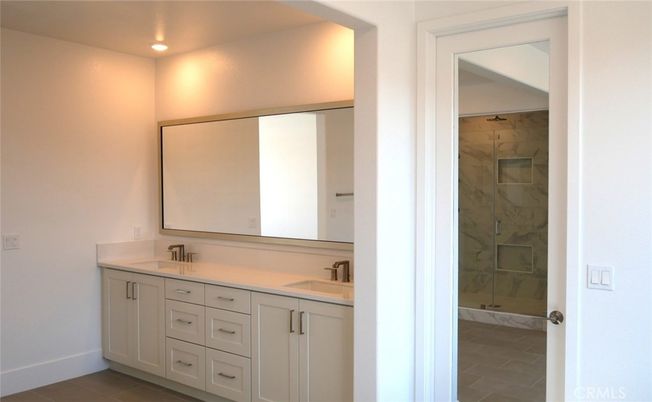 Bathroom, Dual Sink Vanities, Glass Shower, Interior, Marble Walls, Recessed Lighting