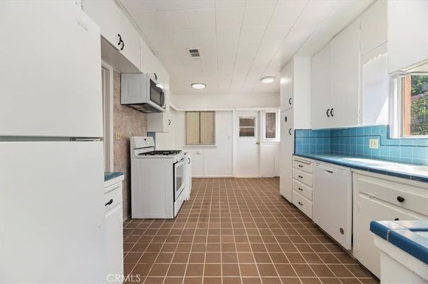 Interior, Kitchen, Recessed Lighting, Tile Countertops, Washer