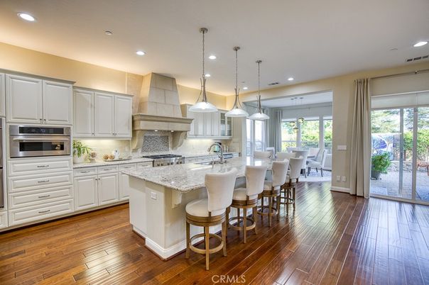 Dining room, Interior, Kitchen, Pendant Lights, Recessed Lighting, Stainless Steel Appliances, Wood Texture Flooring