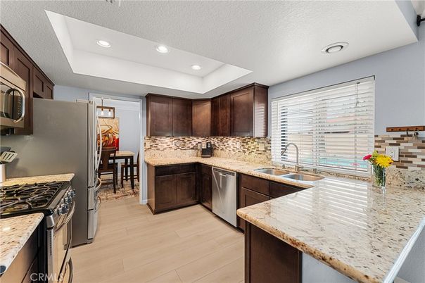 Dining room, Interior, Kitchen, Recessed Lighting, Stainless Steel Appliances, Wood Texture Flooring