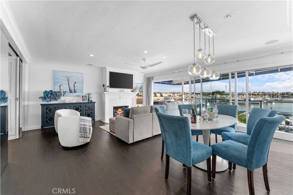 Dining room, Fireplace, Interior, Living room, Pendant Lights, Recessed Lighting, Water, Wood Texture Flooring