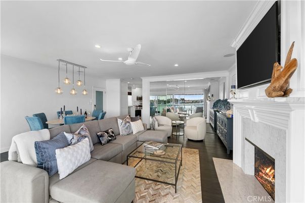 Dining room, Fireplace, Interior, Living room, Pendant Lights, Recessed Lighting, Water, Wood Texture Flooring
