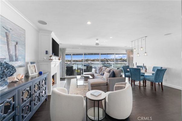 Dining room, Fireplace, Interior, Living room, Pendant Lights, Recessed Lighting, Water, Wood Texture Flooring