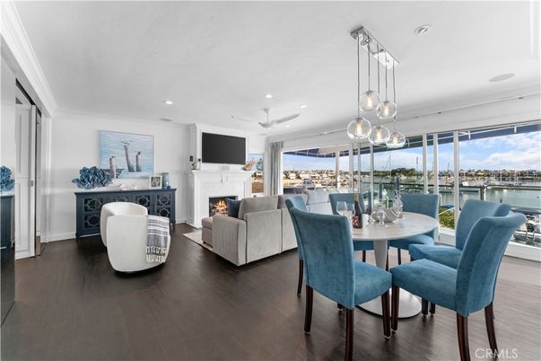 Dining room, Fireplace, Interior, Living room, Pendant Lights, Recessed Lighting, Water, Wood Texture Flooring