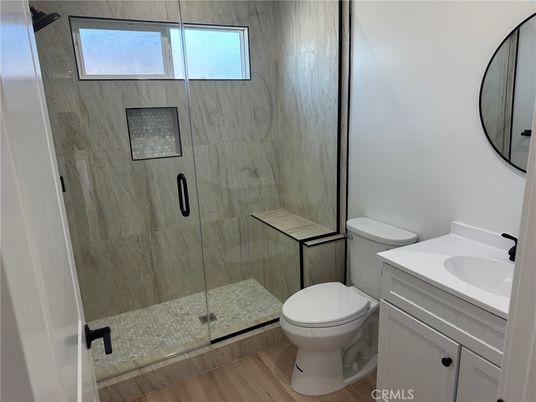 Bathroom, Glass Shower, Interior, Marble Walls, Wood Texture Flooring