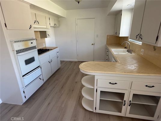 Interior, Kitchen, Tile Countertops, Wood Texture Flooring