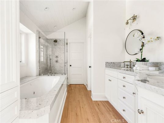 Bathroom, Dual Sink Vanities, Glass Shower, Interior, Recessed Lighting, Wood Texture Flooring