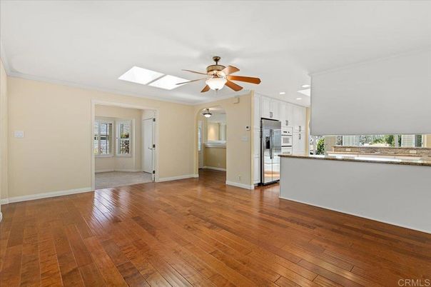 Empty room, Interior, Kitchen, Recessed Lighting, Stainless Steel Appliances, Wood Texture Flooring
