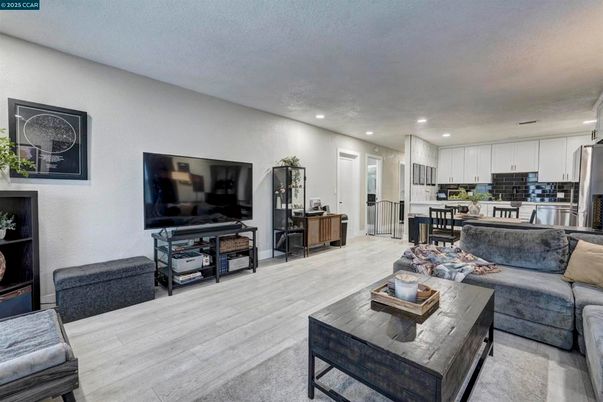 Dining room, Interior, Kitchen, Living room, Recessed Lighting, Stainless Steel Appliances, Wood Texture Flooring