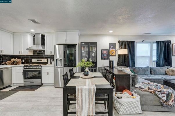 Dining room, Interior, Kitchen, Living room, Recessed Lighting, Stainless Steel Appliances, Wood Texture Flooring