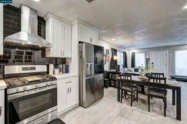 Dining room, Interior, Kitchen, Recessed Lighting, Stainless Steel Appliances, Wood Texture Flooring