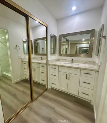 Bathroom, Dual Sink Vanities, Interior, Recessed Lighting, Wood Texture Flooring