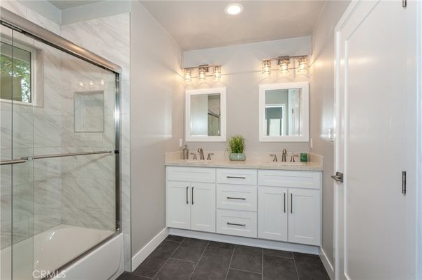 Bathroom, Dual Sink Vanities, Glass Shower, Interior, Marble Walls, Recessed Lighting