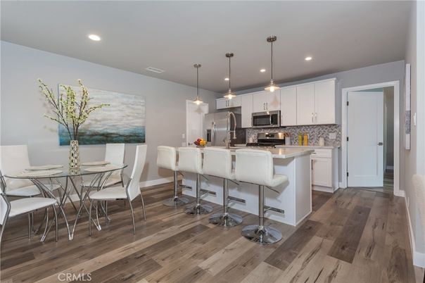 Dining room, Interior, Kitchen, Pendant Lights, Recessed Lighting, Stainless Steel Appliances, Wood Texture Flooring