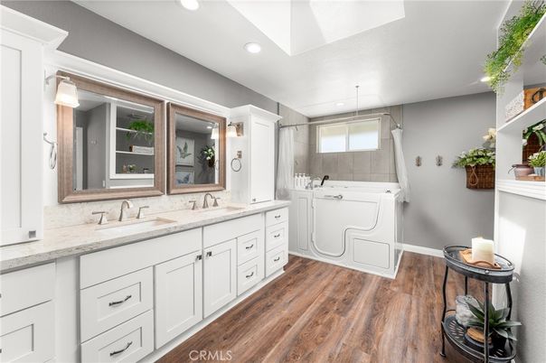 Bathroom, Dual Sink Vanities, Interior, Recessed Lighting, Washer, Wood Texture Flooring