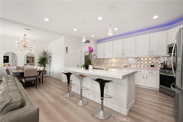 Dining room, Interior, Kitchen, Pendant Lights, Recessed Lighting, Stainless Steel Appliances, Wood Texture Flooring
