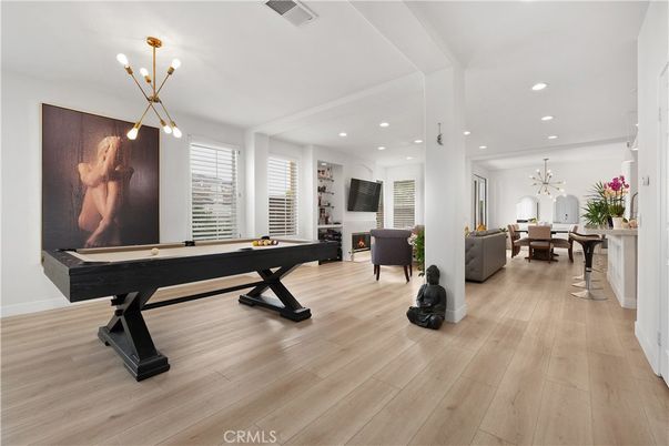 Billiard Table, Fireplace, Game Room, Interior, Living room, Pendant Lights, Recessed Lighting, Wood Texture Flooring