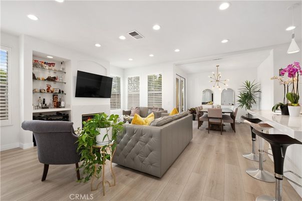 Dining room, Fireplace, Interior, Living room, Pendant Lights, Recessed Lighting, Wood Texture Flooring