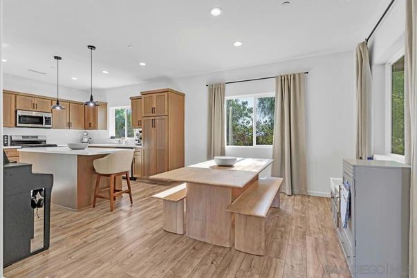 Dining room, Interior, Kitchen, Pendant Lights, Recessed Lighting, Stainless Steel Appliances, Wood Texture Flooring