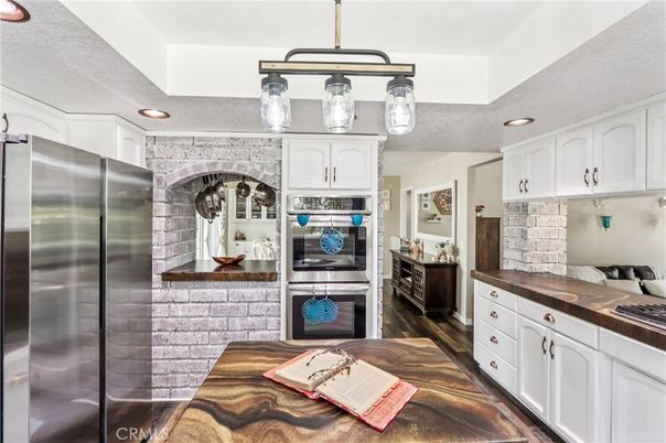 Interior, Kitchen, Pendant Lights, Recessed Lighting, Stainless Steel Appliances, Stone Walls, Wood Texture Flooring