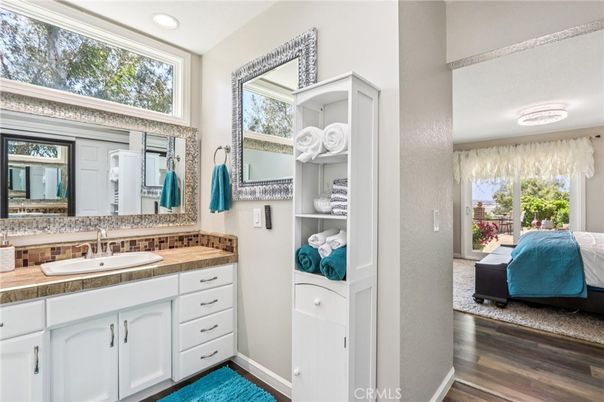 Bathroom, Interior, Recessed Lighting, Tile Countertops, Wood Texture Flooring