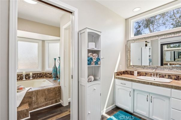 Bathroom, Dual Sink Vanities, Interior, Recessed Lighting, Tile Countertops, Wood Texture Flooring