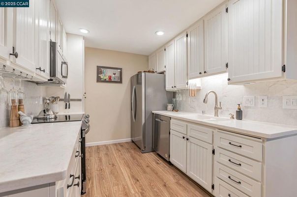 Interior, Kitchen, Recessed Lighting, Stainless Steel Appliances, Wood Texture Flooring