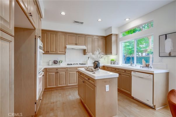 Interior, Kitchen, Recessed Lighting, Tile Countertops, Wood Texture Flooring