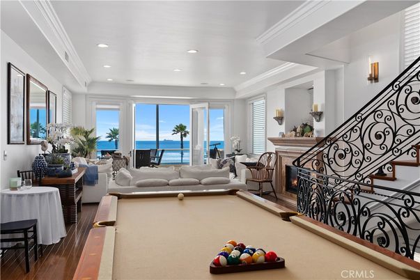 Billiard Table, Fireplace, Game Room, Interior, Living room, Recessed Lighting, Water, Wood Texture Flooring