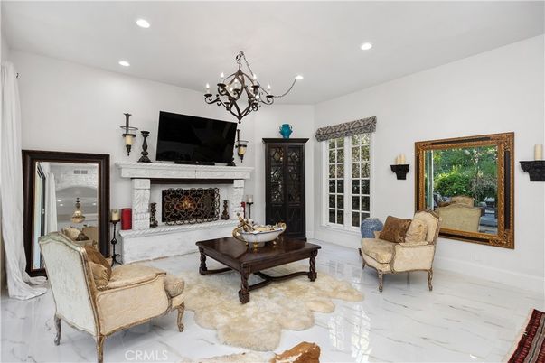 Chandelier, Fireplace, Interior, Living room, Marble, Recessed Lighting