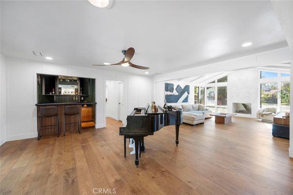 Fireplace, Interior, Living room, Piano, Recessed Lighting, Wood Texture Flooring