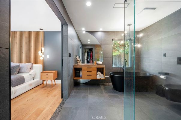 Bathroom, Dual Sink Vanities, Free Standing Baths, Glass Shower, Interior, Recessed Lighting, Wood Texture Flooring