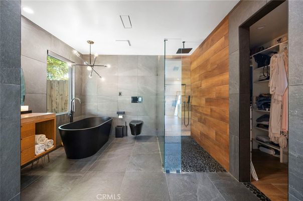 Bathroom, Dual Sink Vanities, Free Standing Baths, Glass Shower, Interior, Pendant Lights, Recessed Lighting, Wooden Walls
