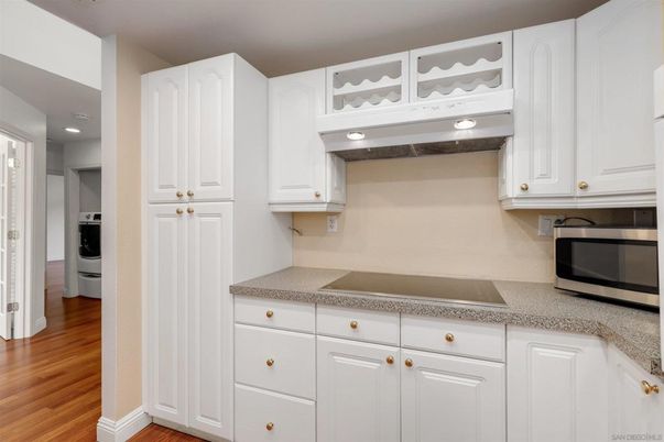 Interior, Kitchen, Recessed Lighting, Washer, Wood Texture Flooring
