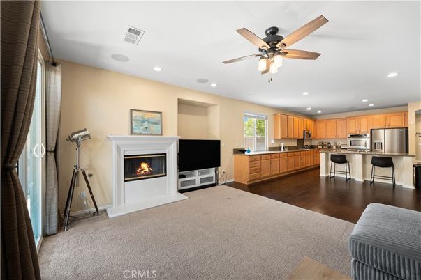 Fireplace, Interior, Kitchen, Recessed Lighting, Stainless Steel Appliances, Wood Texture Flooring