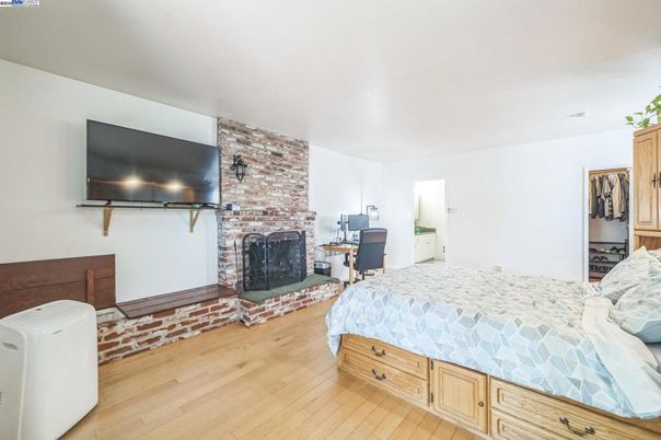 Bedroom, Fireplace, Interior, Stone Walls, Wood Texture Flooring