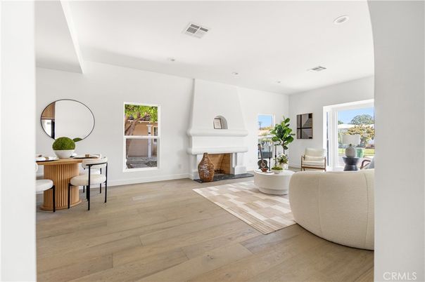 Dining room, Fireplace, Interior, Living room, Recessed Lighting, Wood Texture Flooring