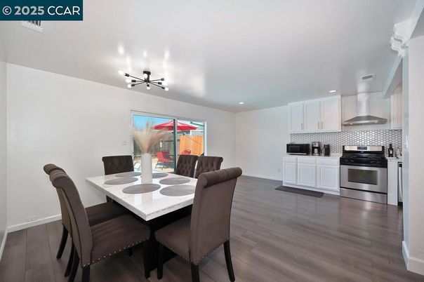Dining room, Interior, Kitchen, Pendant Lights, Recessed Lighting, Stainless Steel Appliances, Wood Texture Flooring