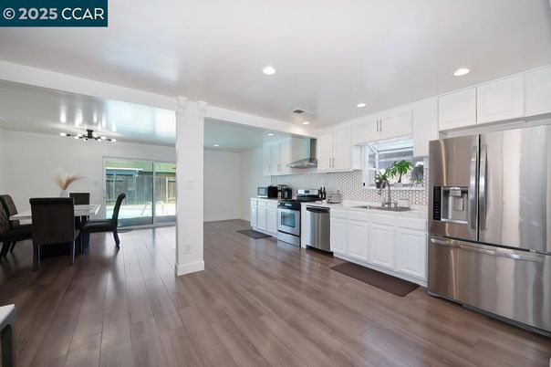 Dining room, Interior, Kitchen, Recessed Lighting, Stainless Steel Appliances, Wood Texture Flooring