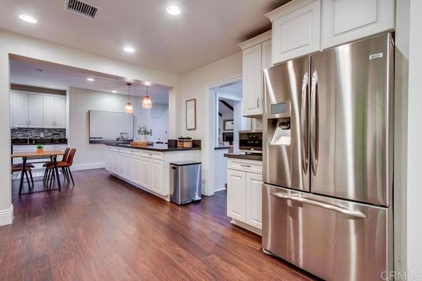 Dining room, Interior, Kitchen, Pendant Lights, Recessed Lighting, Stainless Steel Appliances, Wood Texture Flooring