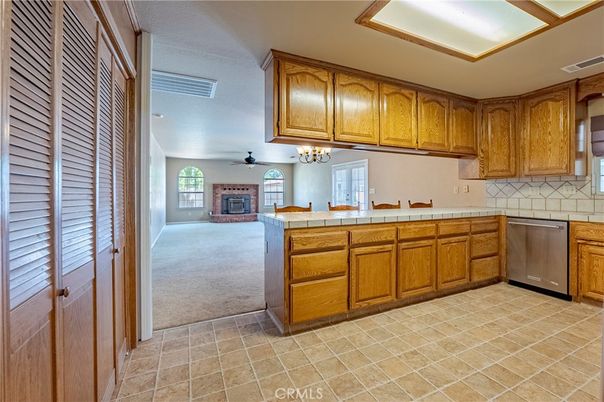 Chandelier, Fireplace, Interior, Kitchen, Tile Countertops